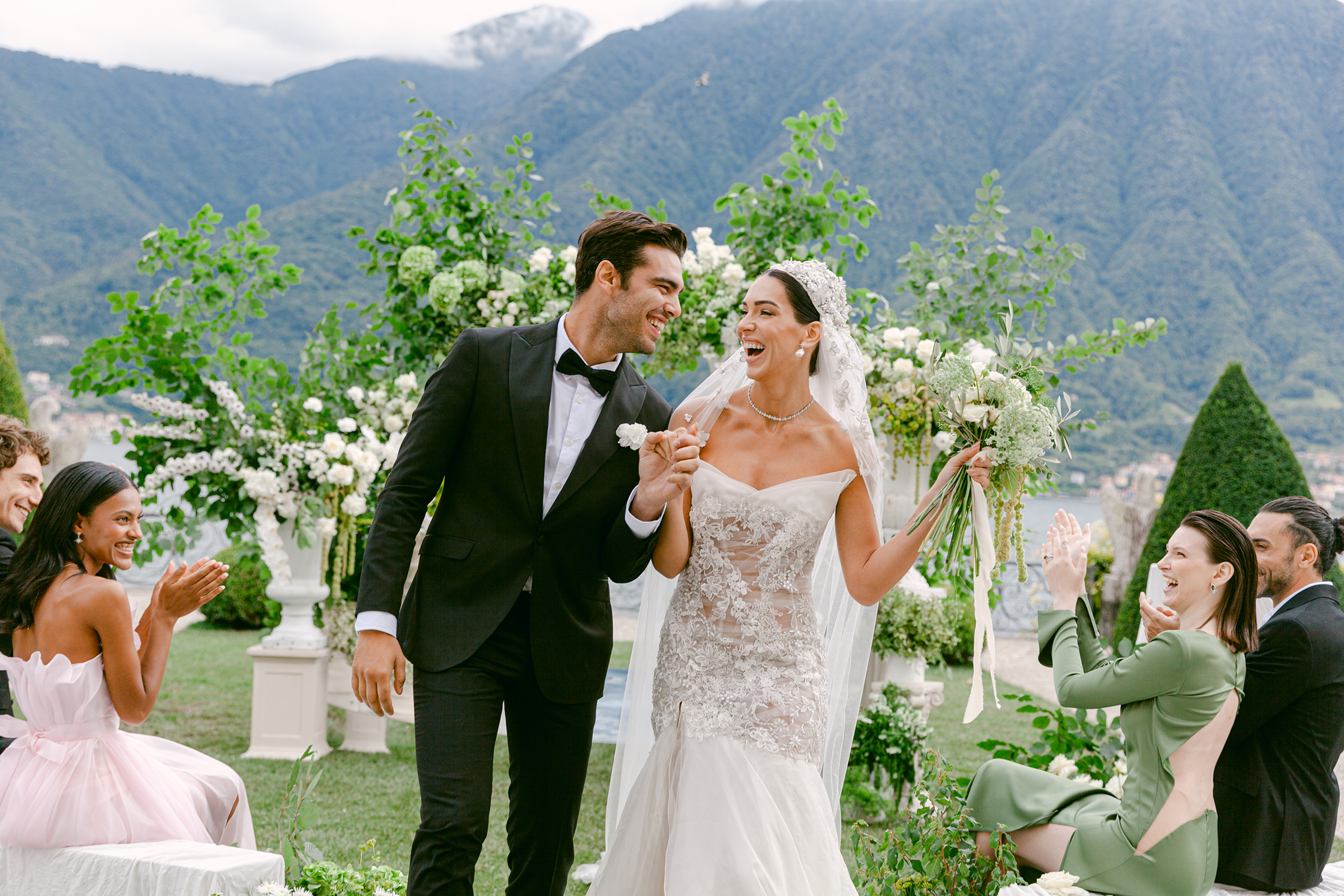 Newlyweds celebrating after their ceremony at Villa Balbiano