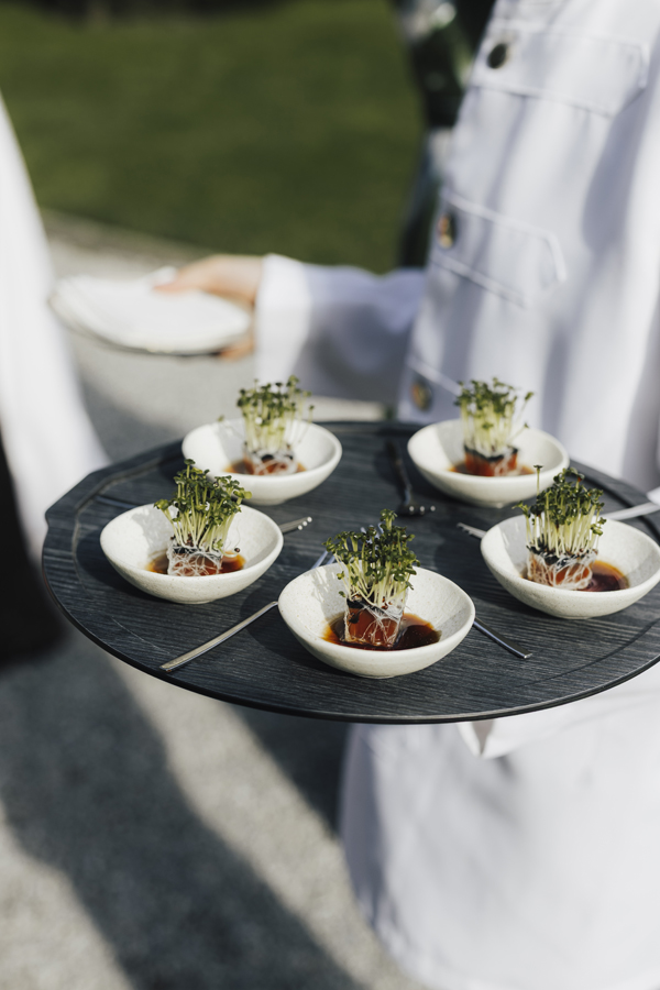Small savoury bites carried on a tray during aperitivo at Villa Pizzo.