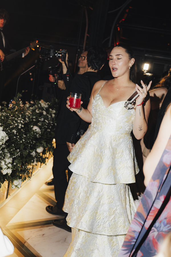 The bride dances with guests during the indoor party at Villa Pizzo.