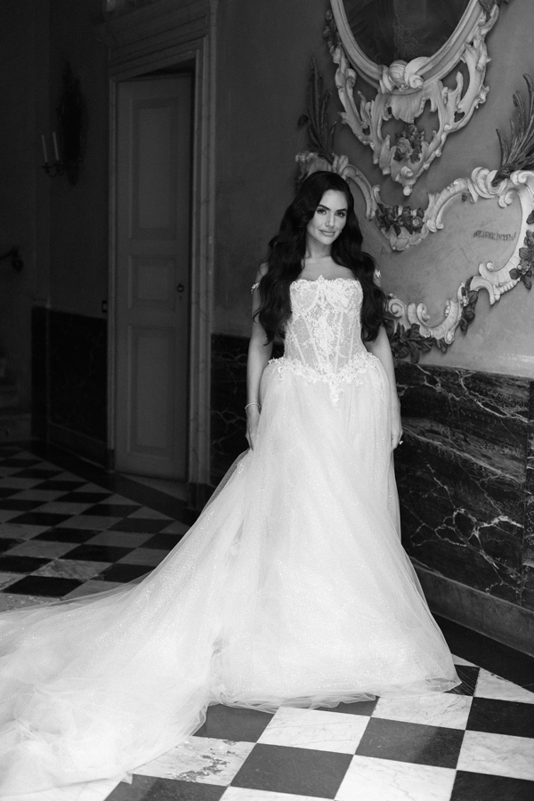 Black-and-white portrait of the bride in her wedding gown inside Villa Pizzo.