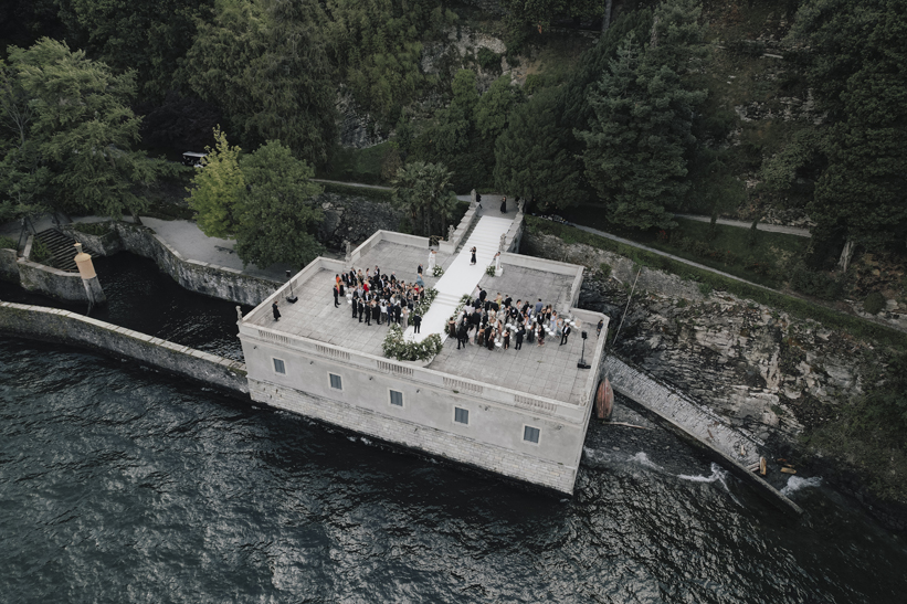 Aerial view of the lakeside ceremony terrace and guests at Villa Pizzo.
