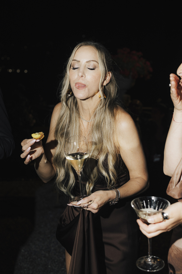 A guest tastes dessert during the Villa Pizzo evening party.