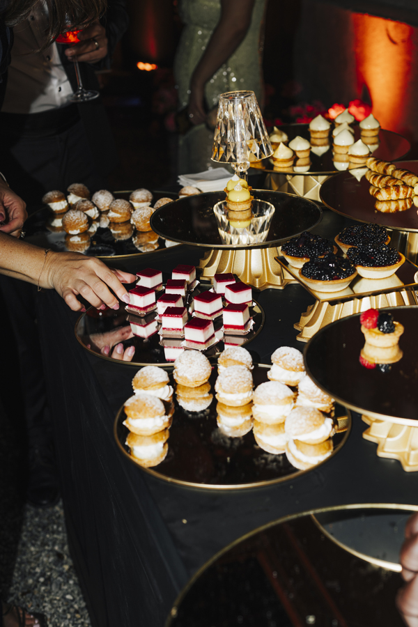 A table of small desserts served during the evening celebration at Villa Pizzo.