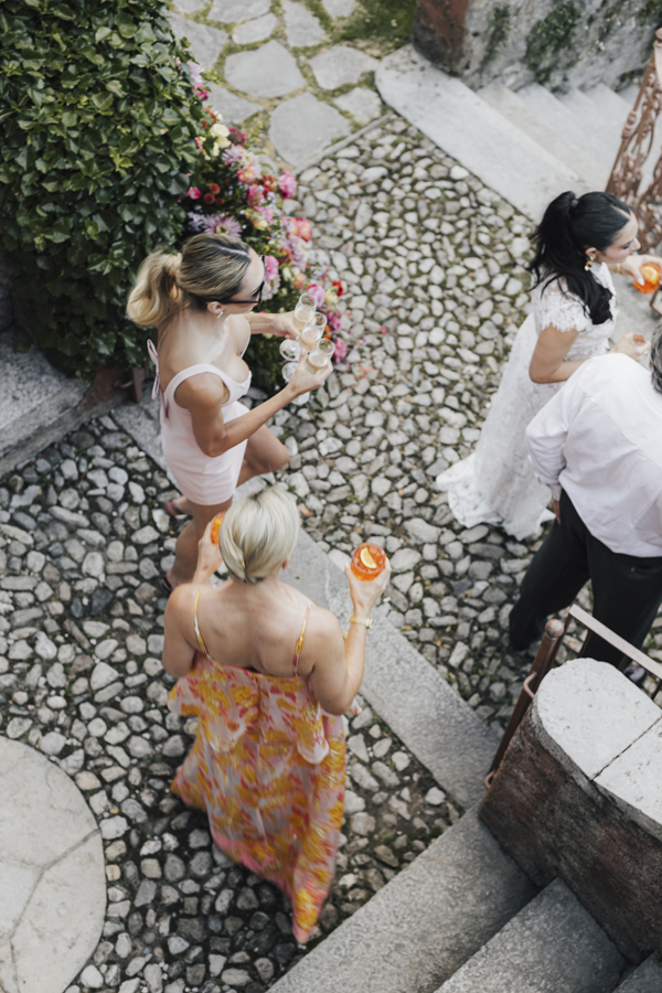 Overhead view of guests gathering along a garden path at Villa Regina Teodolinda.