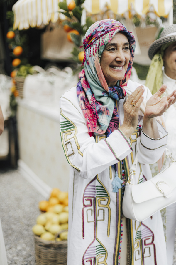 A smiling guest in a colourful headscarf at Villa Regina Teodolinda.