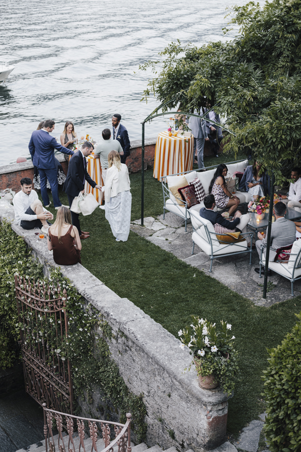 Aerial view of guests in the lakeside garden at Villa Regina Teodolinda.