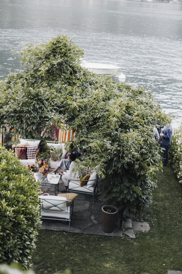 View from above of the lakeside lounge and leafy garden at Villa Regina Teodolinda.