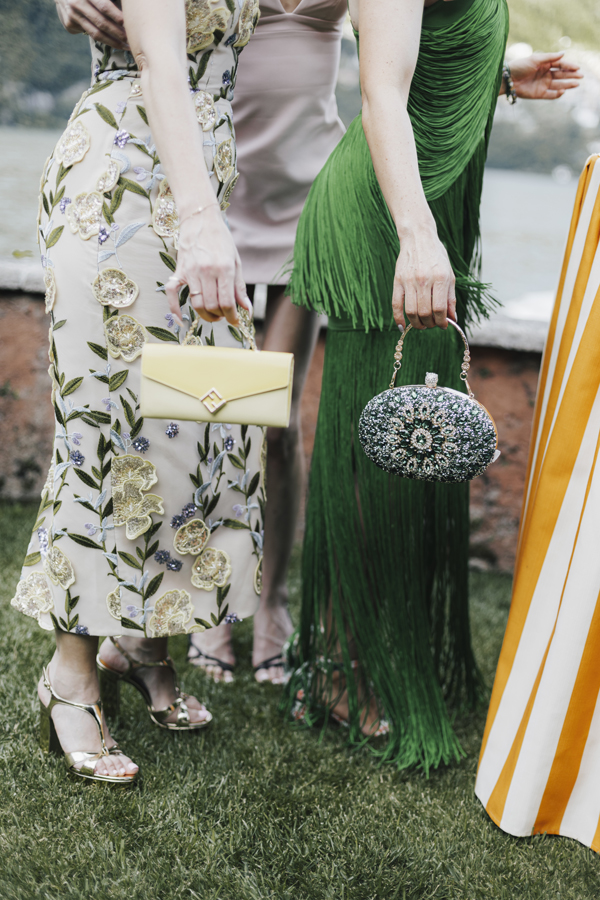 Summer outfits and handbags photographed in the garden at Villa Regina Teodolinda.