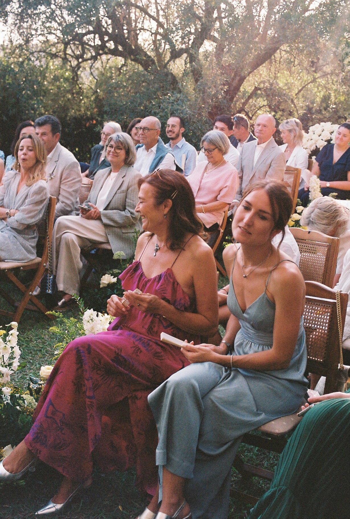 Wedding guests in warm afternoon light photographed on 35mm film