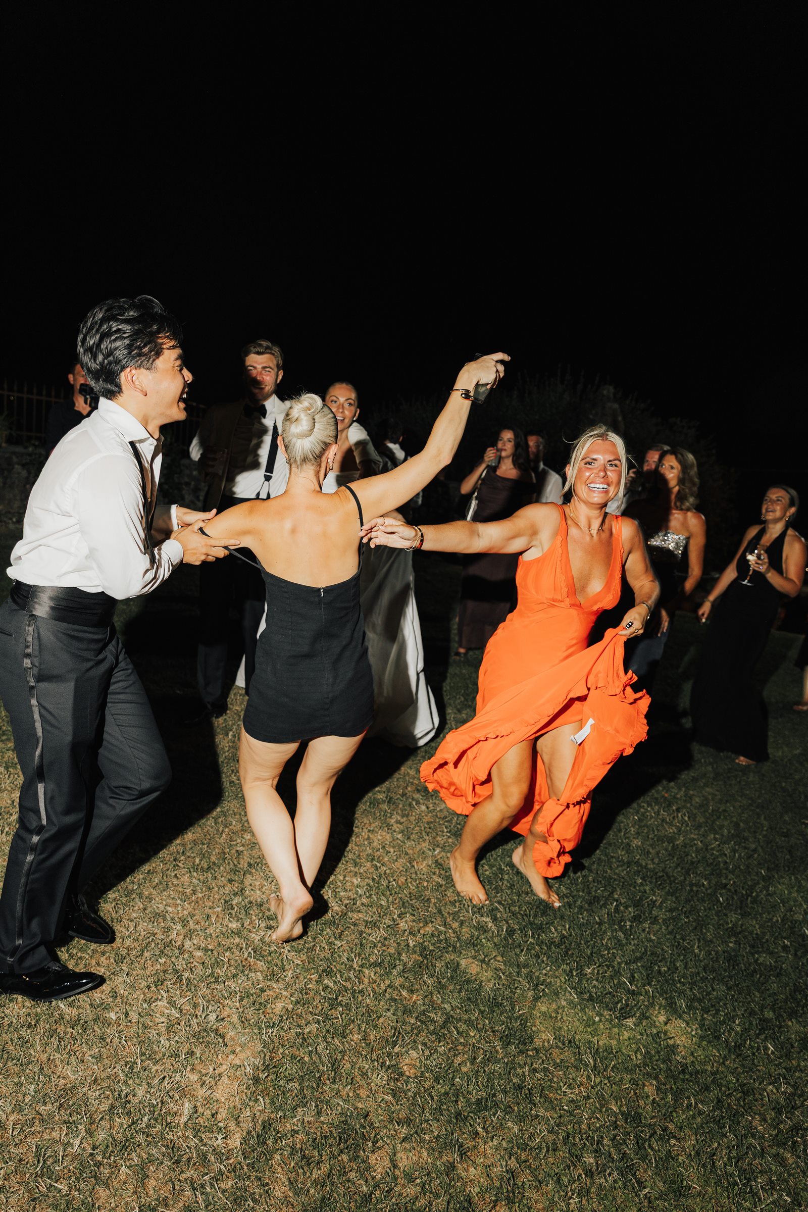 Wedding guests dancing after dark at Villa Arvedi