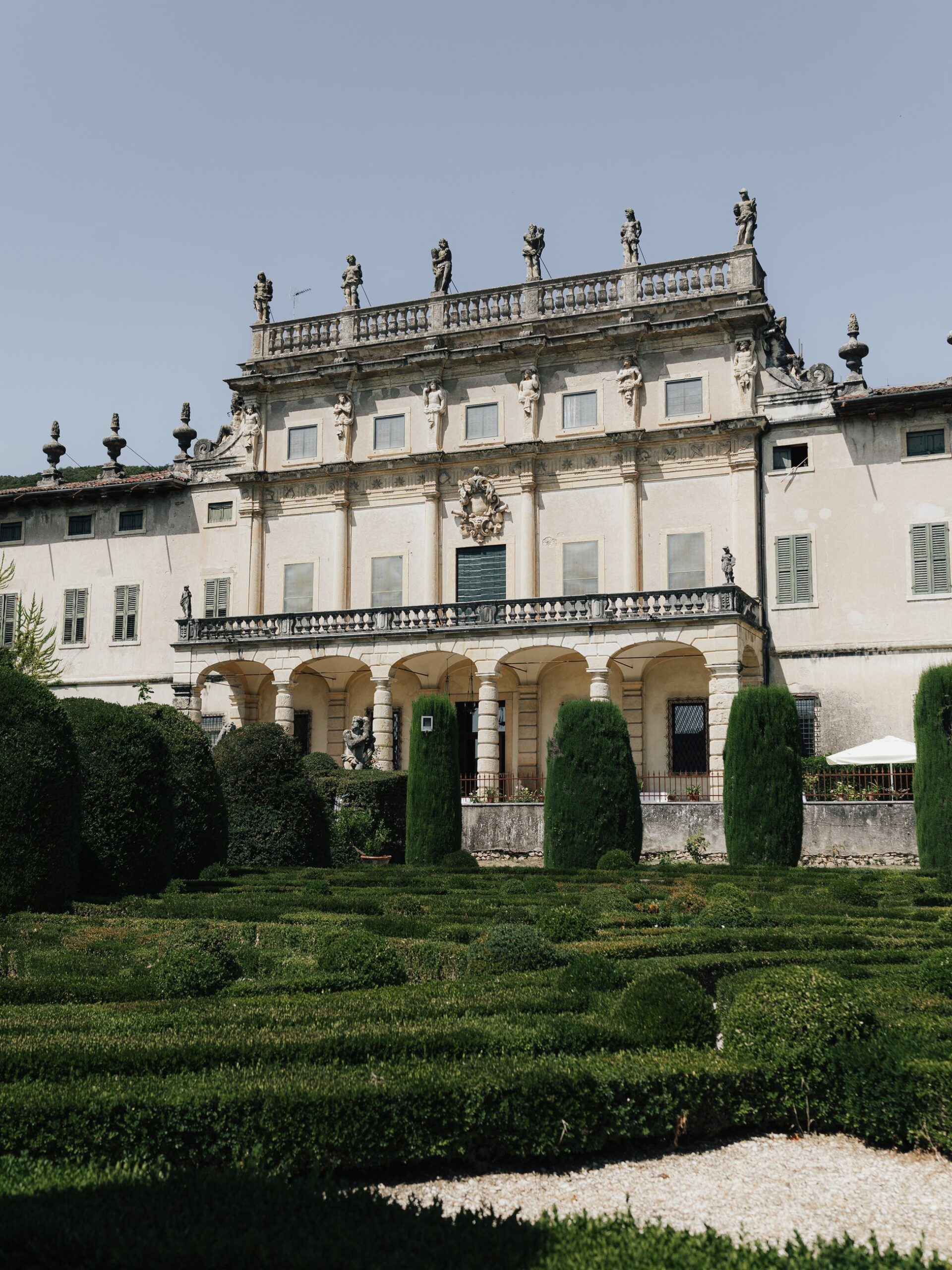The historic façade and gardens of Villa Arvedi