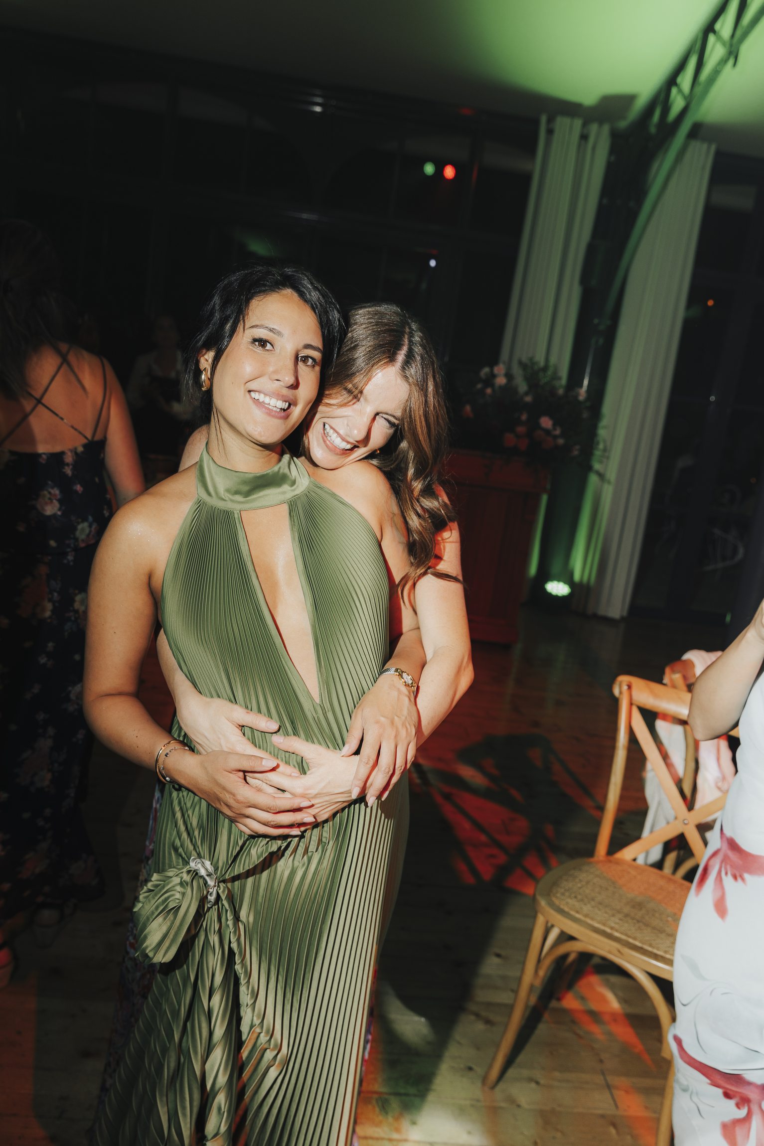 Wedding guests sharing a spontaneous moment after dark