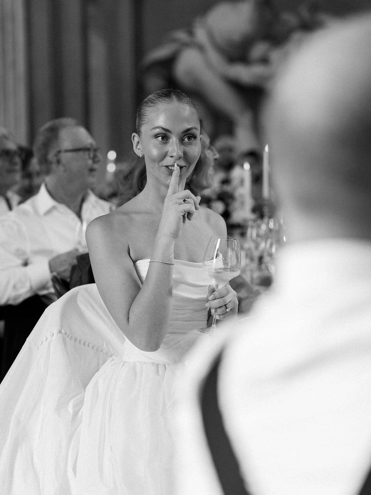 A candid reaction from the bride during dinner