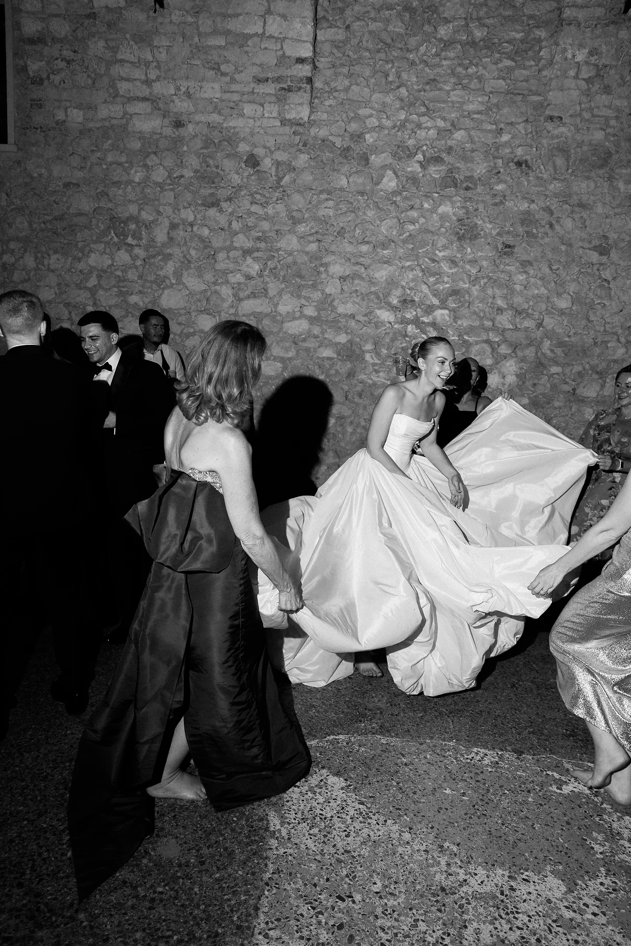The bride disappearing into the energy of the dance floor