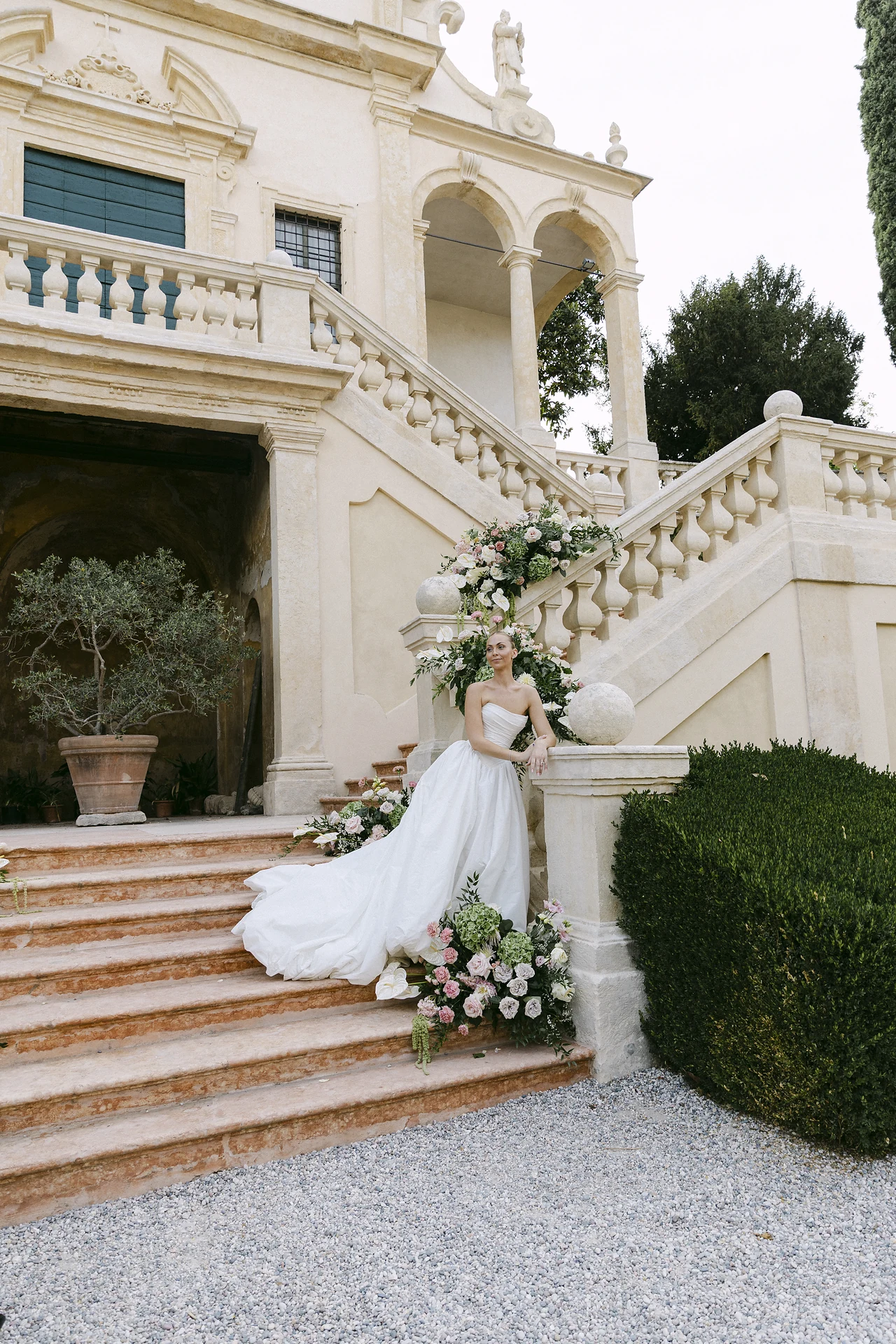 The bride on Villa Arvedi's decorated staircase