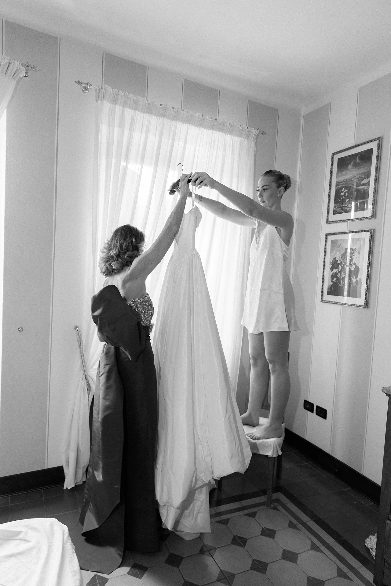 The wedding dress being prepared before the ceremony