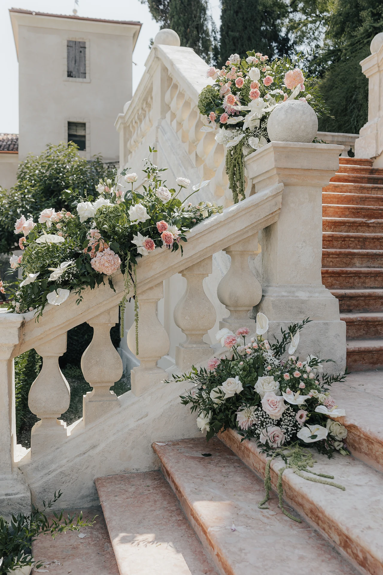 Flowers arranged along Villa Arvedi's monumental staircase