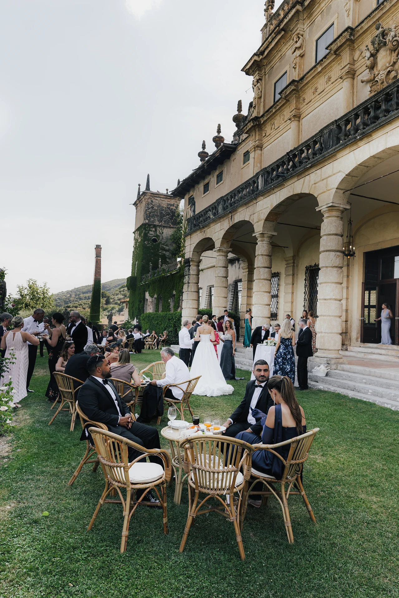 Guests gathering for cocktails beside the villa