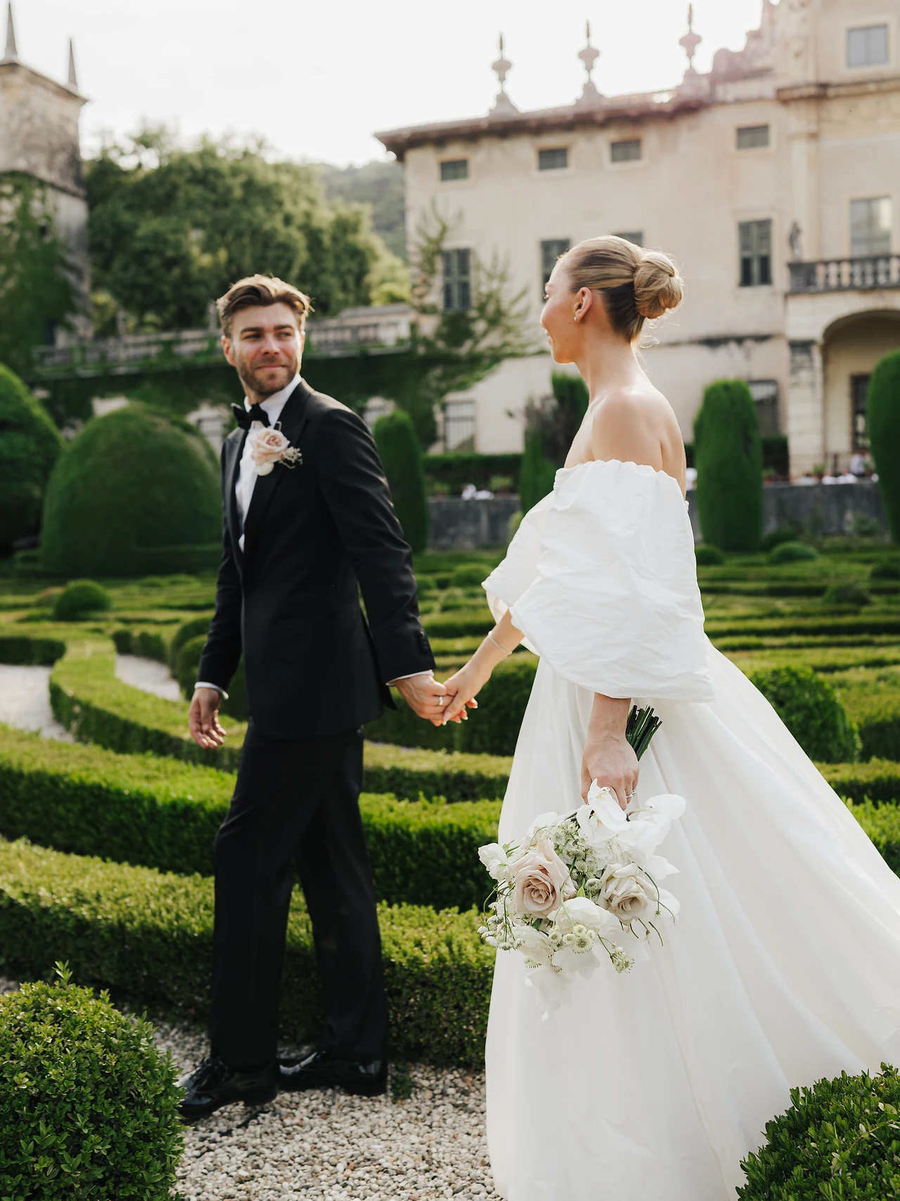 A portrait among the clipped hedges of the Italian garden