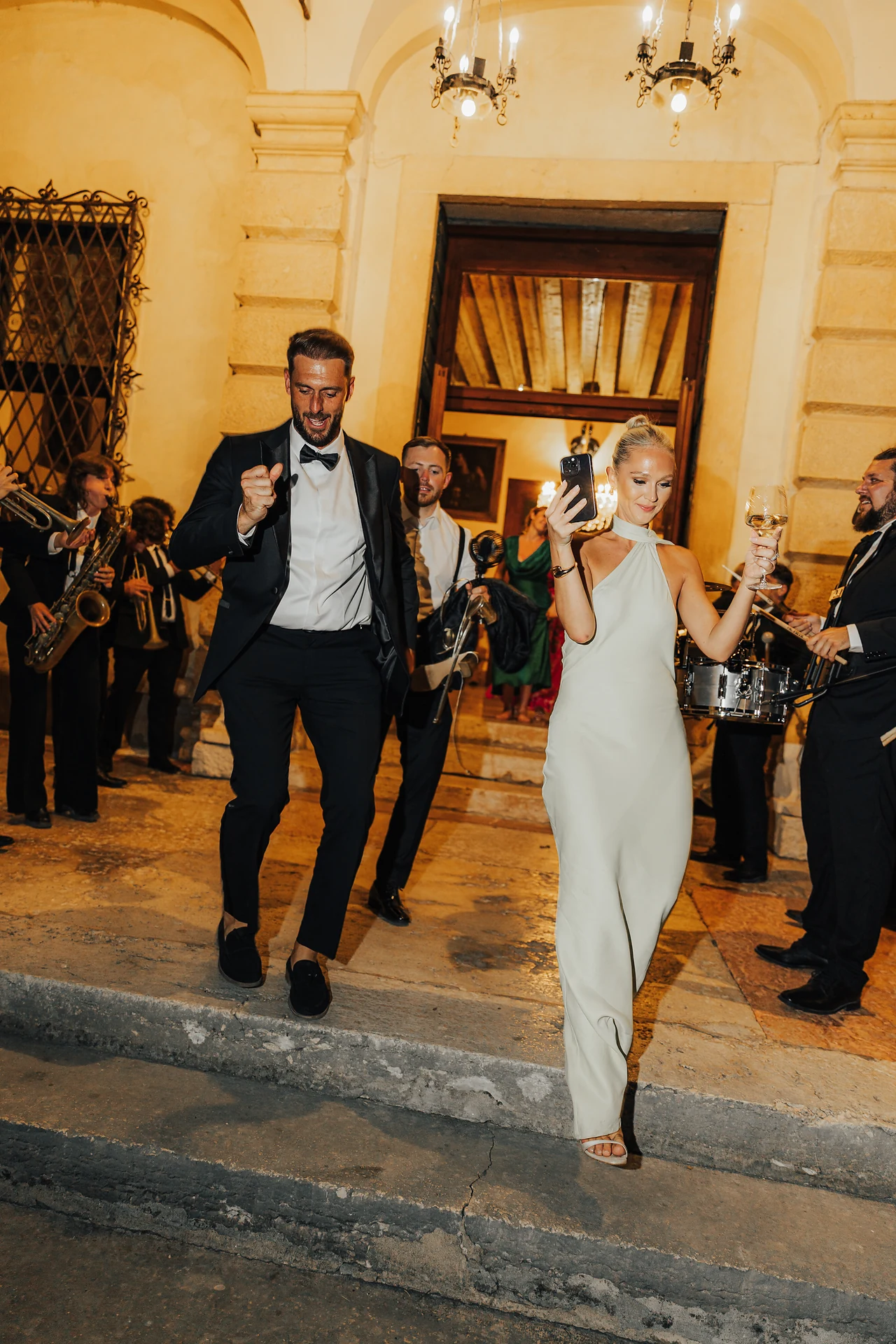The newlyweds stepping back into the celebration after dinner