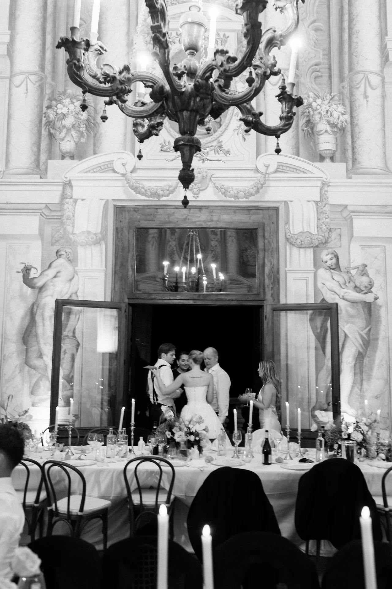 A black and white celebration beneath the chandelier