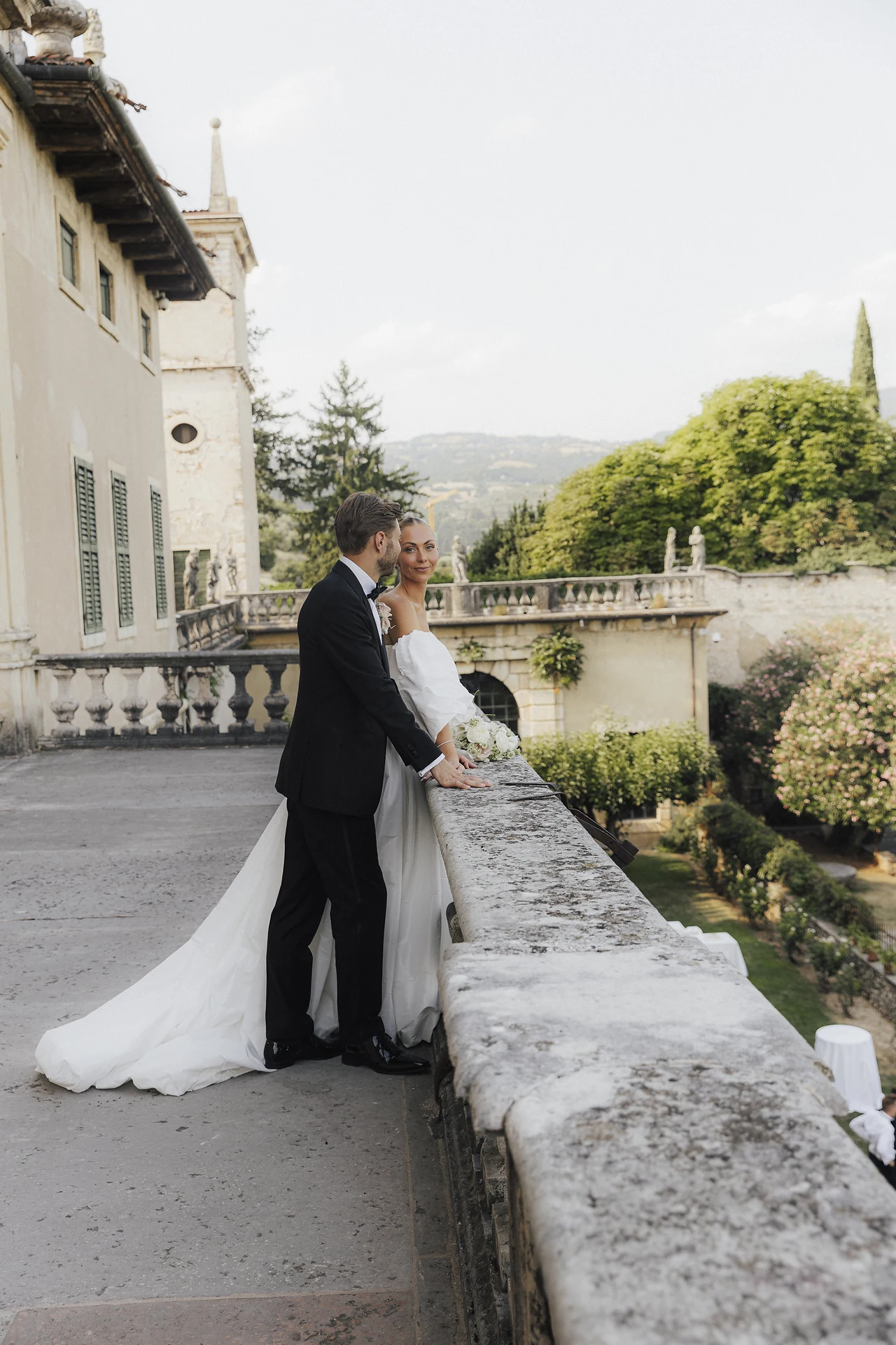 The newlyweds on the terrace above the formal garden