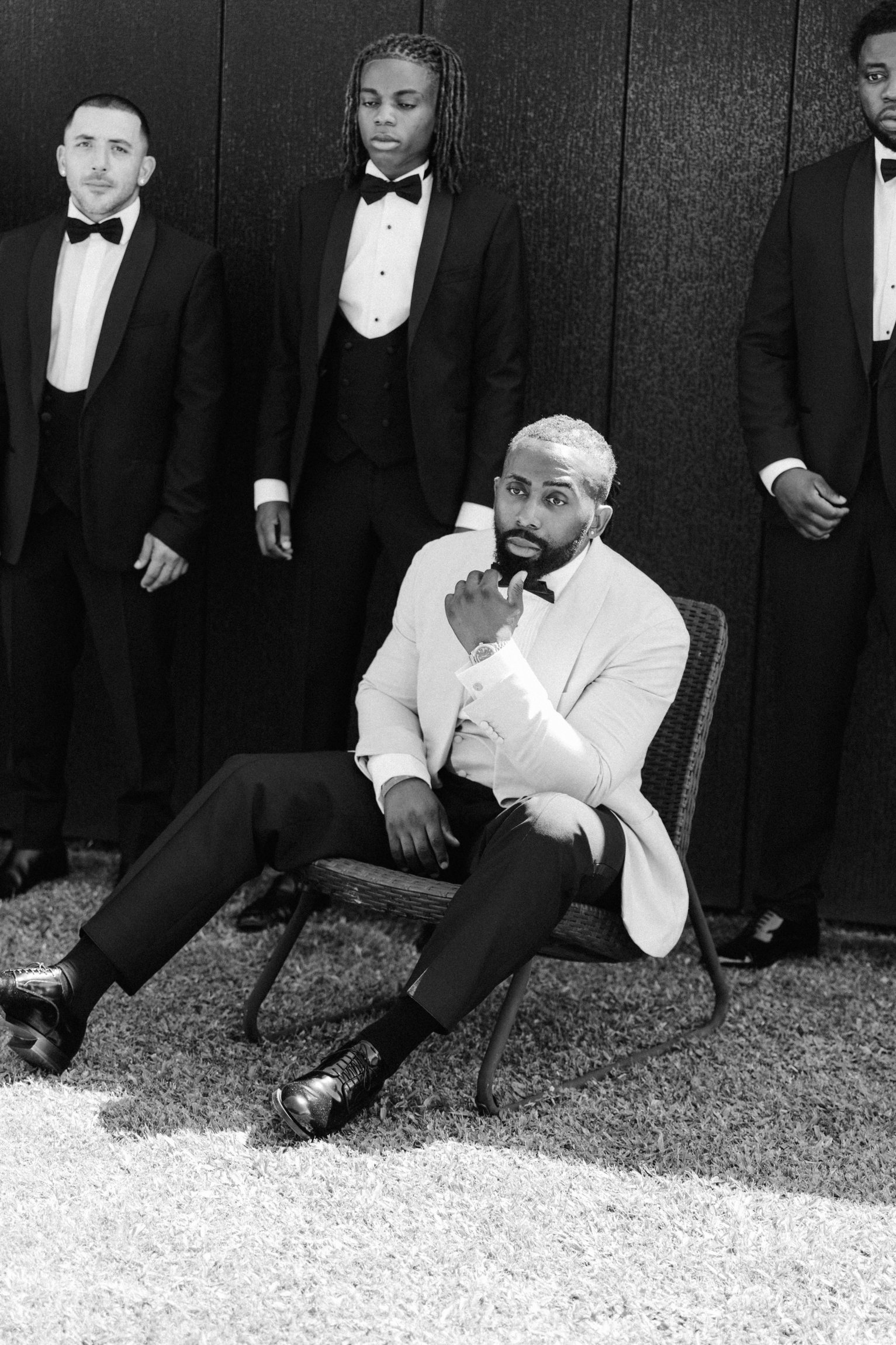 Groom and wedding party in formal black tie
