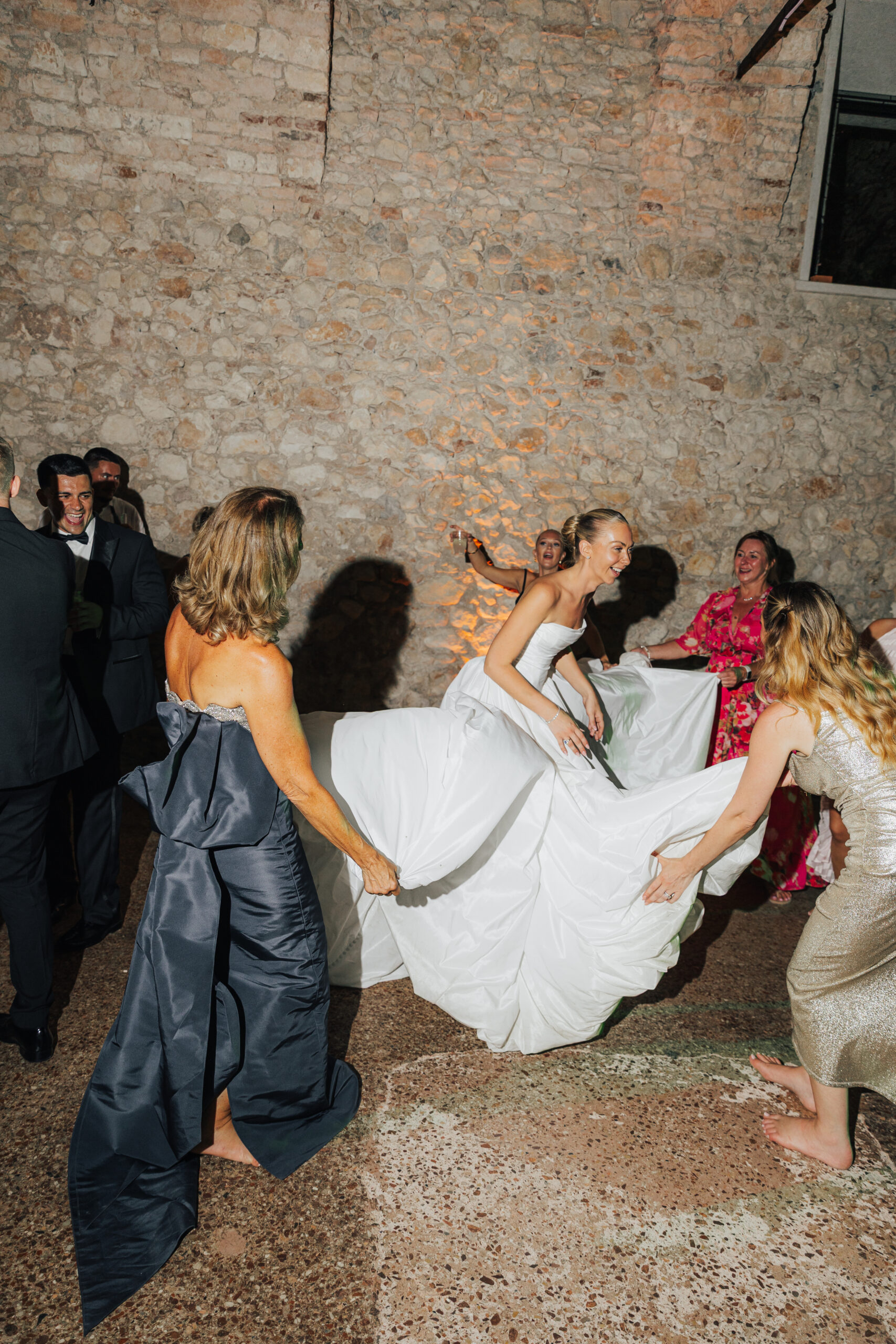 Bride moving through the evening celebration at Villa Arvedi