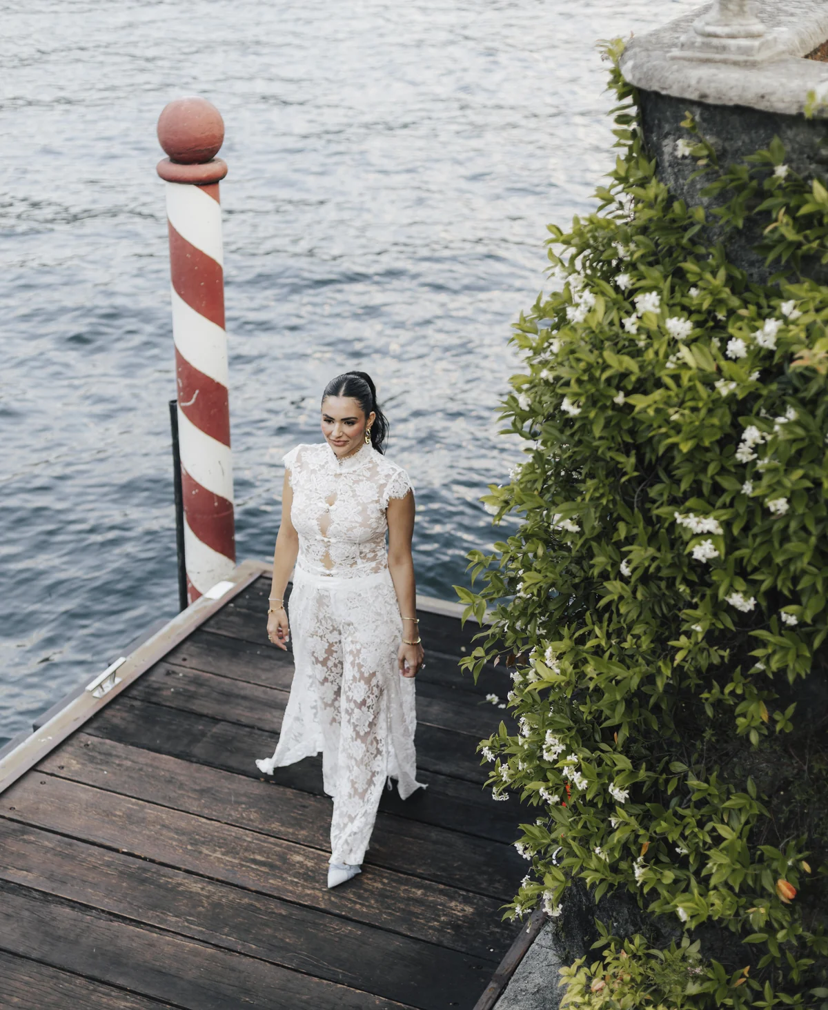 The bride walks beside Lake Como at Villa Pizzo