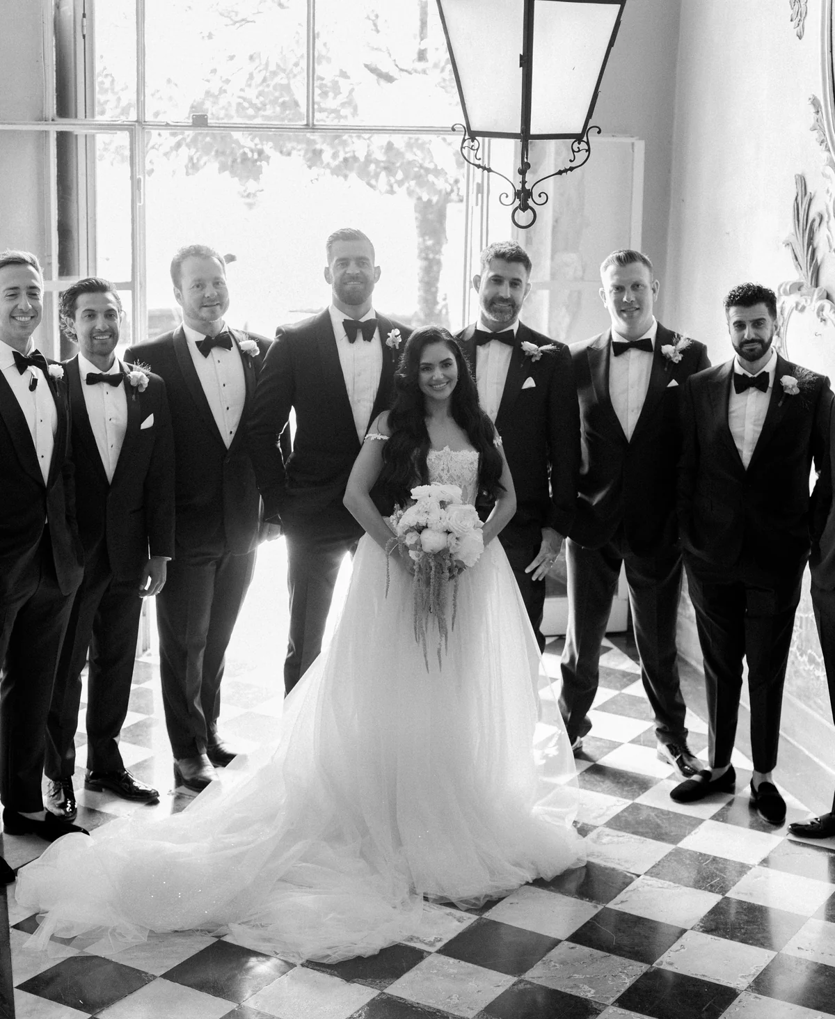 A bride with her wedding party at Villa Pizzo in black and white