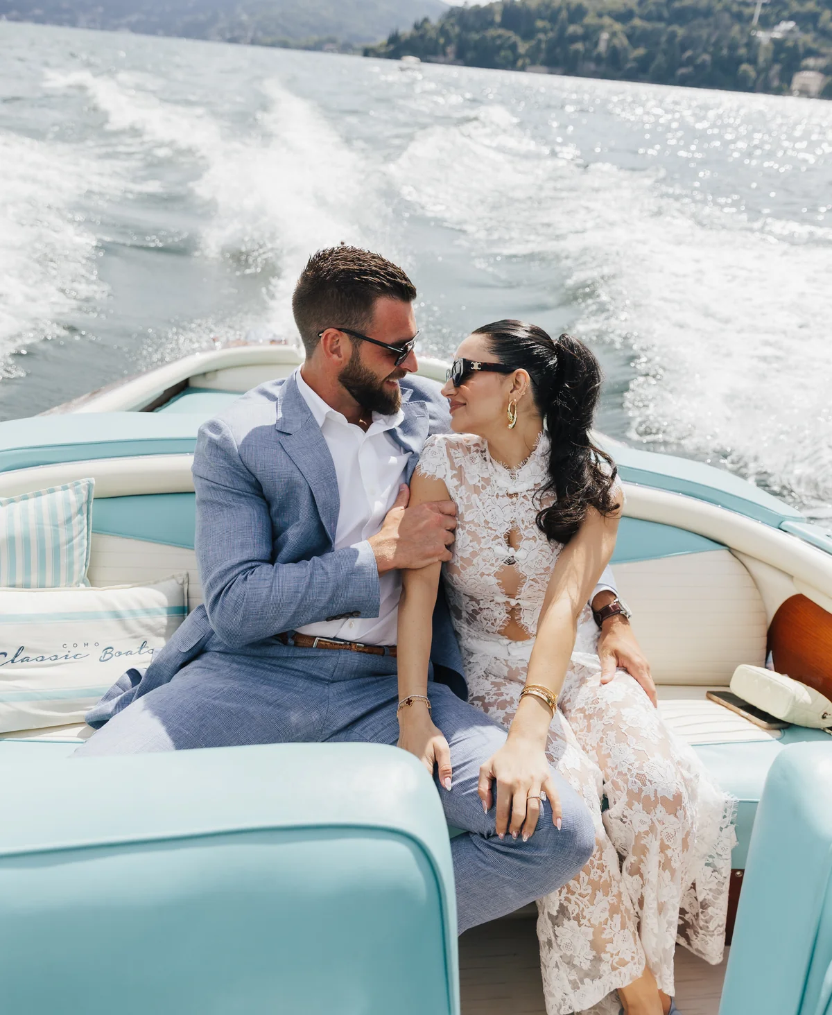 Newlyweds enjoying a private boat ride on Lake Como