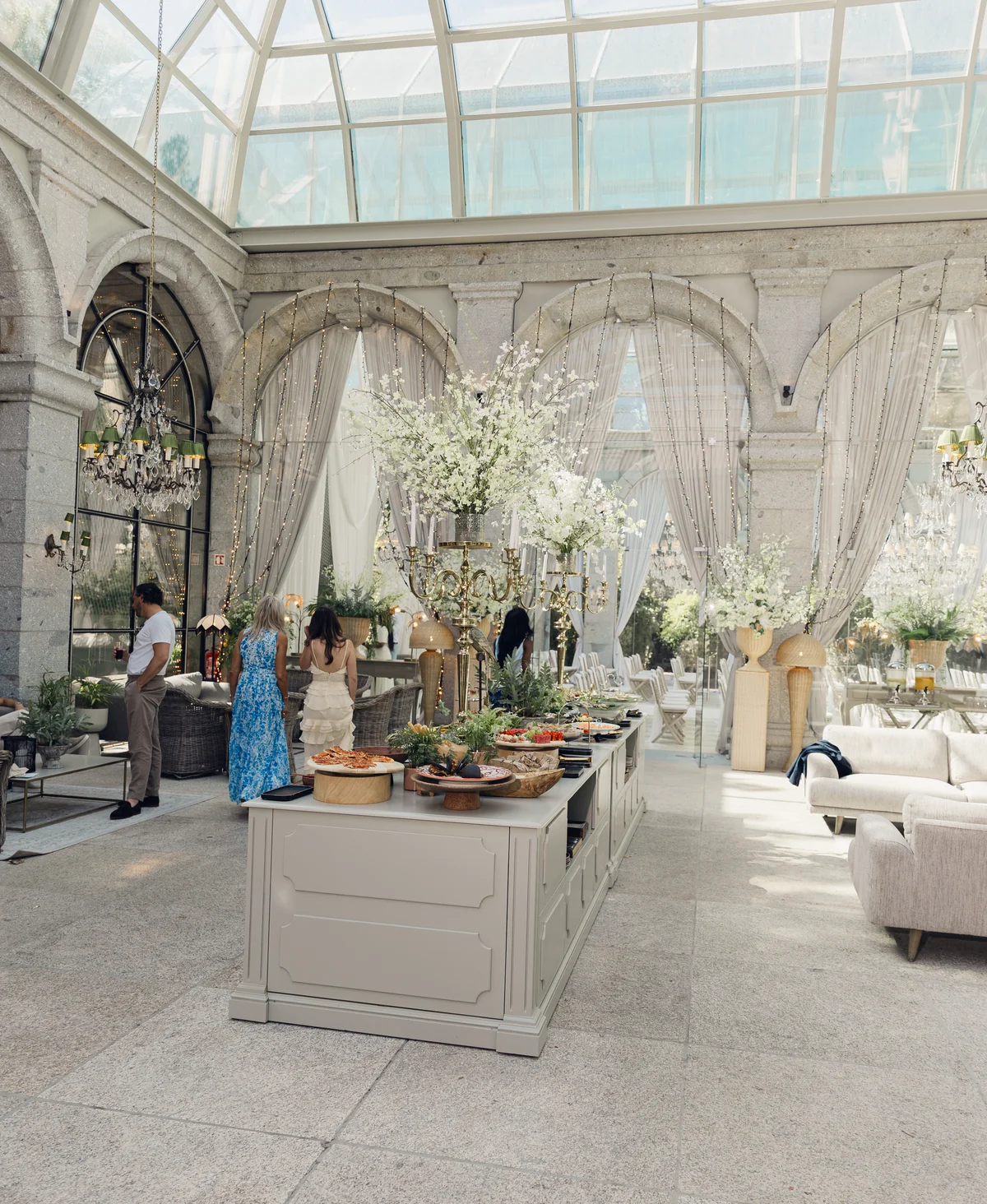 Crystal chandeliers and a styled reception in the glass pavilion at Solar da Levada