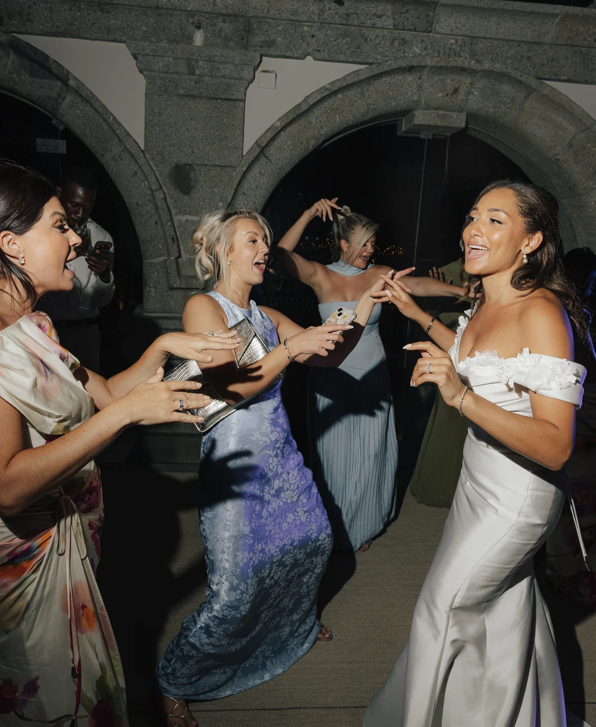 The bride and her guests dancing after dark at Solar da Levada