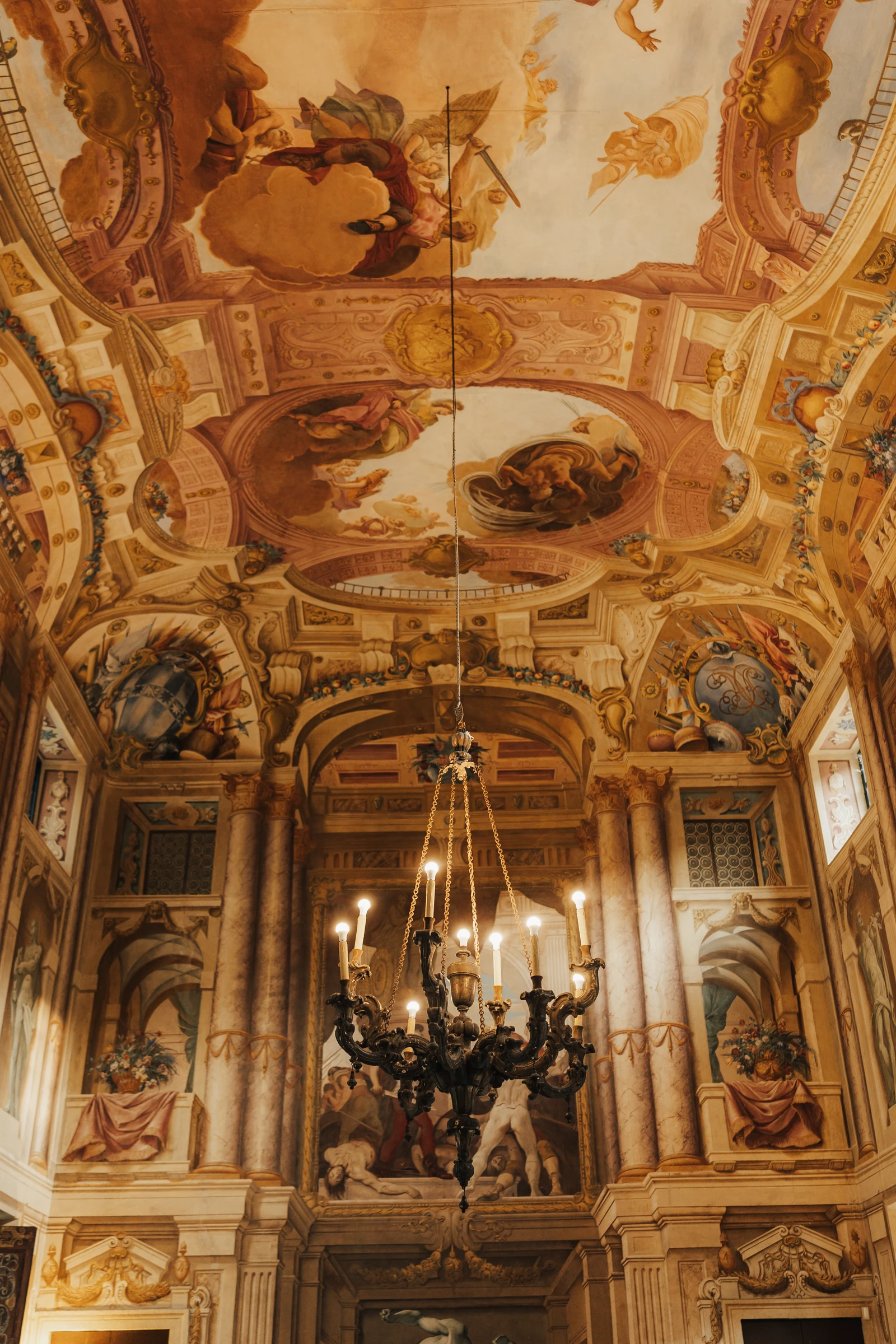 Frescoed ceiling and chandelier in the reception hall at Villa Arvedi near Verona.