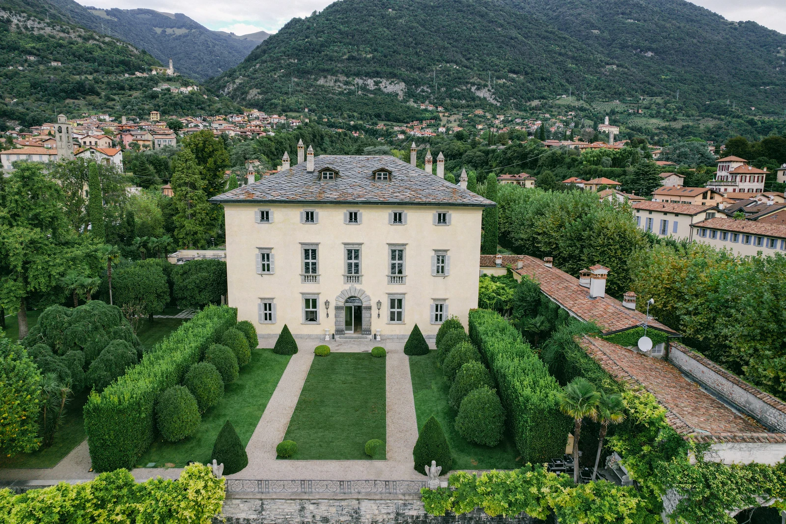 Aerial view of Villa Balbiano and its symmetrical formal gardens on Lake Como.