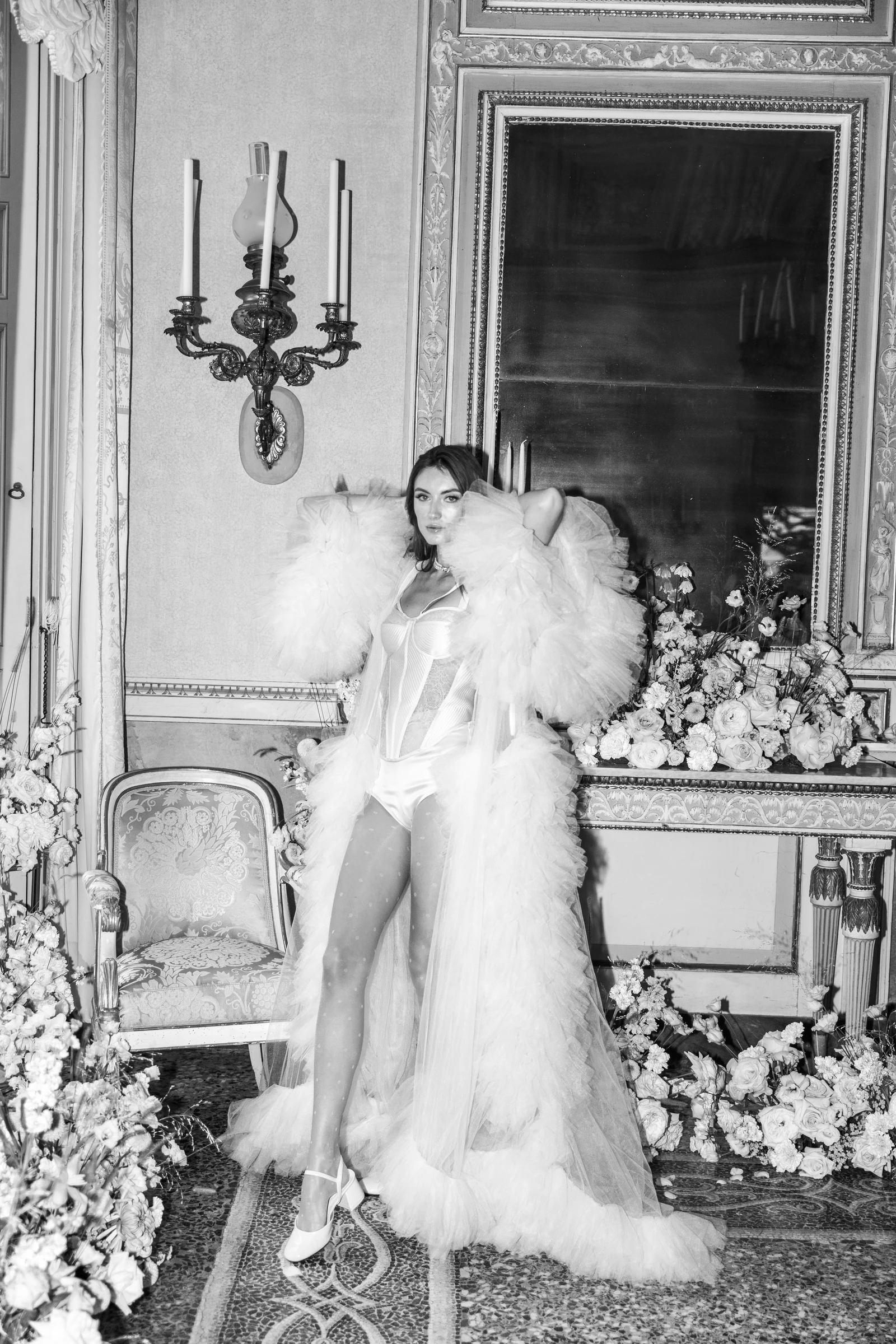 Bride in a feathered couture look inside Villa Pizzo on Lake Como.