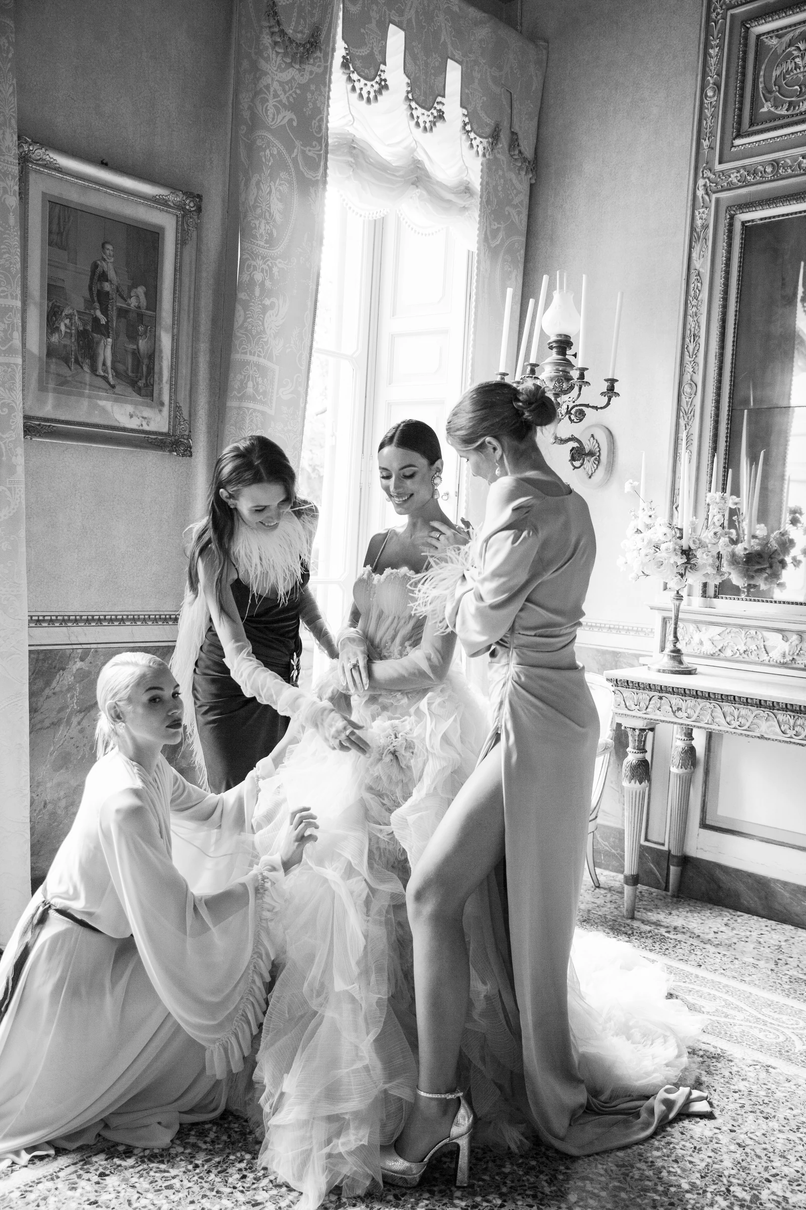 Friends helping the bride with her wedding dress at Villa Pizzo.